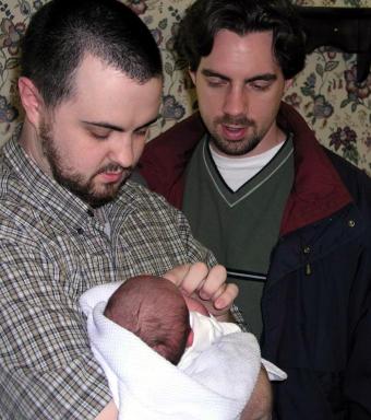 Paul holds Owen while I look on